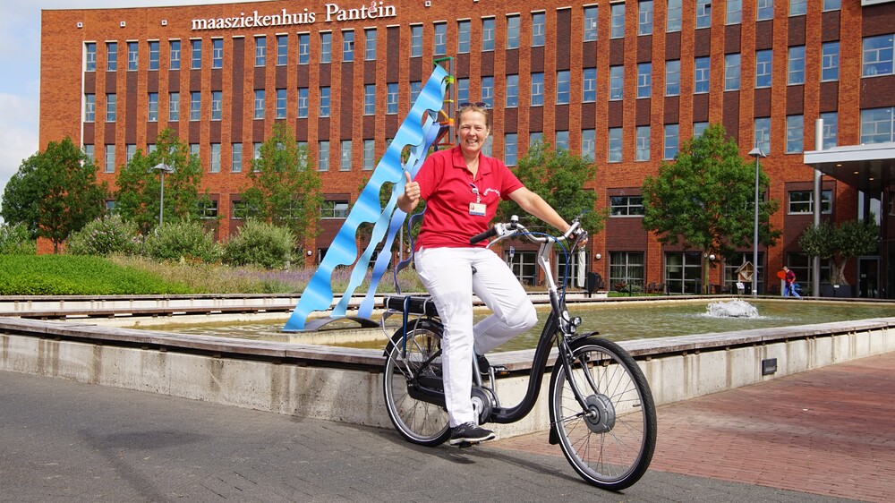Fysiotherapeute op fiets App blok